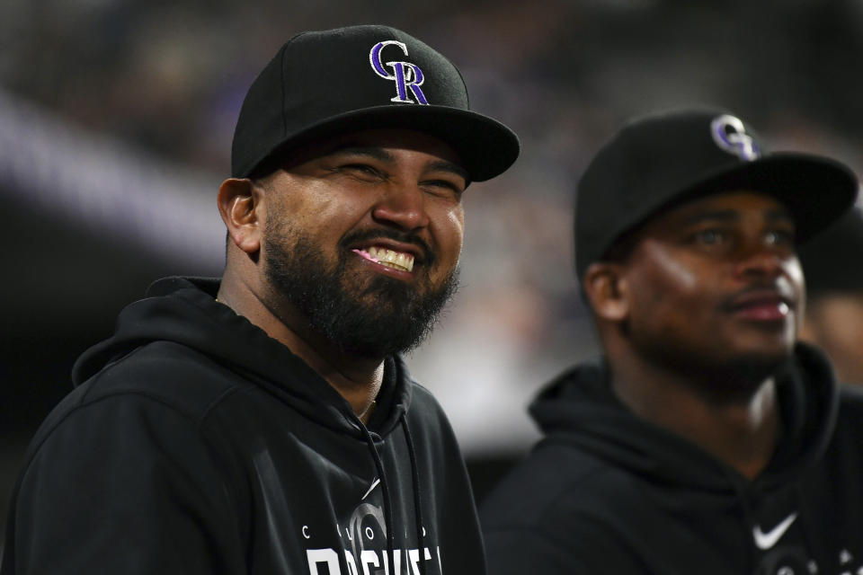 Colorado Rockies German Marquez smiles from the dugout during the seventh inning agains the St. Louis Cardinals of a baseball game Tuesday, April 11, 2023, in Denver. (AP Photo/John Leyba)