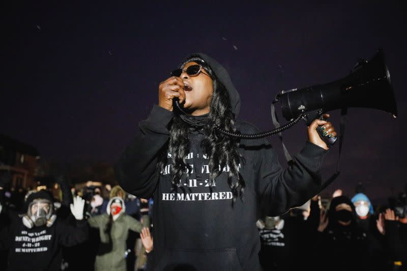 Activists confront officers following a march for Daunte Wright, who was shot and killed by former Brooklyn Center Police Officer Kim Potter, in Brooklyn Center, Minnesota