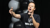 Ryan Smith, co-founder and chairman of Smith Entertainment Group, speaks before Utah NHL hockey team is introduced to fans during a welcome event Wednesday, April 24, 2024, in Salt Lake City. (AP Photo/Rick Bowmer)