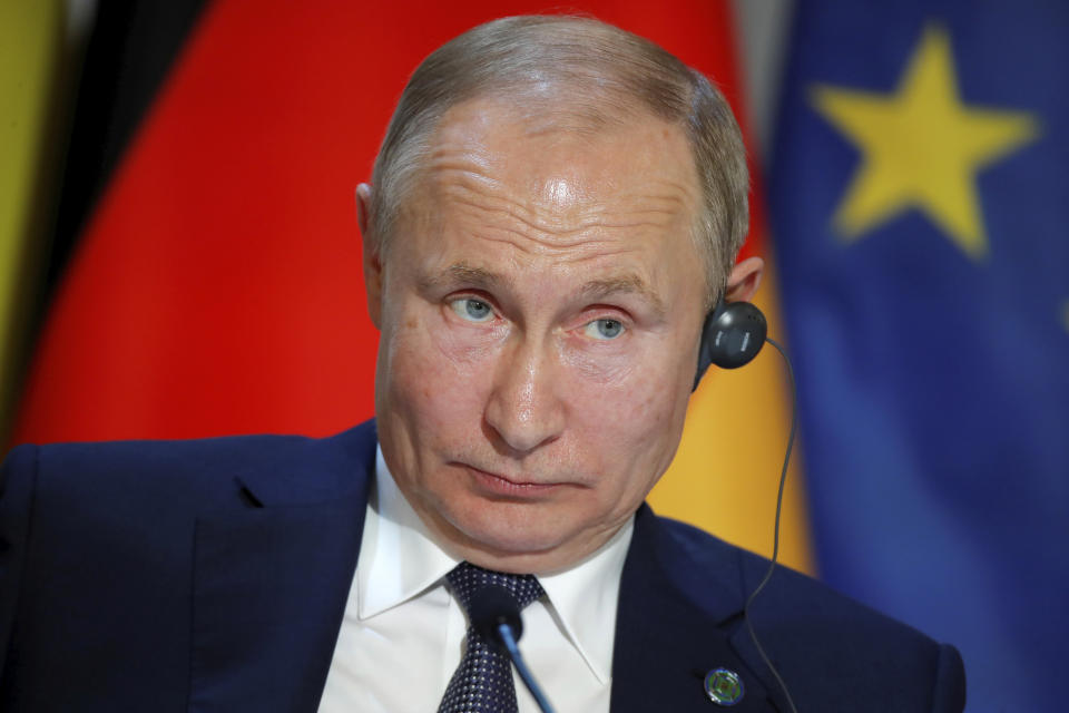 Russian President Vladimir Putin attends a joint press conference with Ukraine's President Volodymyr Zelenskiy, French President Emmanuel Macron and German Chancellor Angela Merkel at the Elysee Palace in Paris, Monday Dec. 9, 2019. Russian President Vladimir Putin and Ukrainian President Volodymyr Zelenskiy met for the first time Monday at a summit in Paris to try to end five years of war between Ukrainian troops and Russian-backed separatists. (Charles Platiau/Pool via AP)