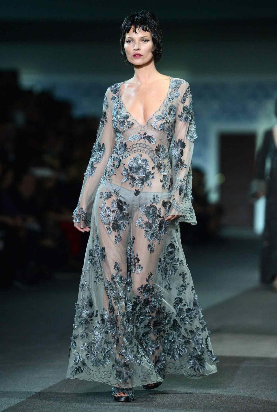 <p>During Paris Fashion Week in 2013, Moss walked the runway during the Louis Vuitton Fall/Winter ready-to-wear show in an embellished sheer gown and a black bob wig. </p>