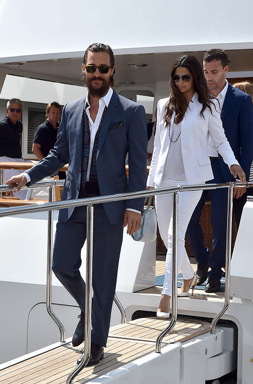 McConaughey looked ultra European in a blue suit and white shirt topped off with a sash. Meanwhile, Alves’s all-white look - fitted blazer, basic tank, and sophisticated sling-backs - is what everyone wants to wear this summer.