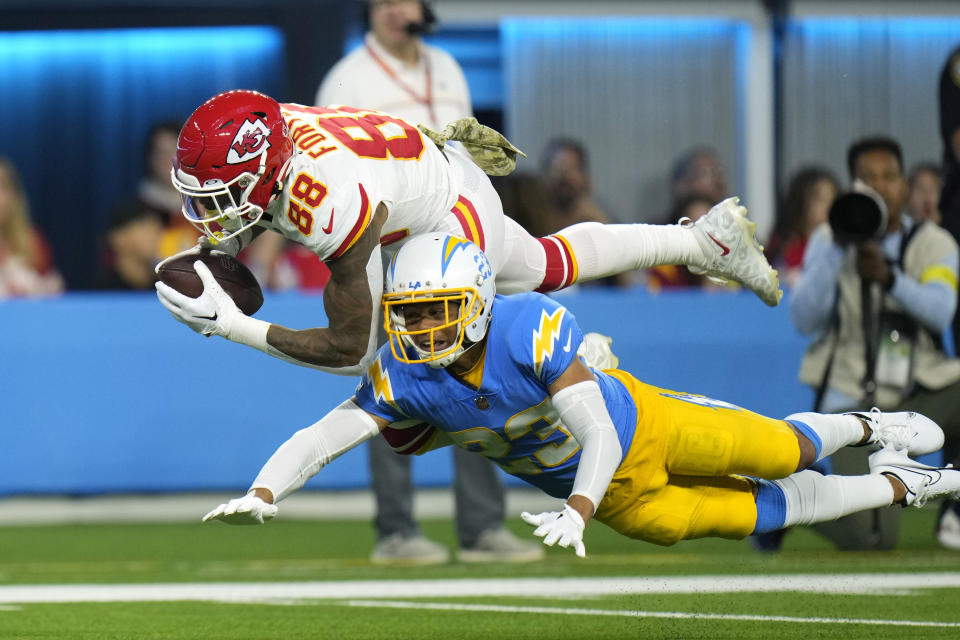 Kansas City Chiefs tight end Jody Fortson, top, makes a catch as Los Angeles Chargers cornerback Bryce Callahan defends during the first half of an NFL football game Sunday, Nov. 20, 2022, in Inglewood, Calif. (AP Photo/Jae C. Hong)