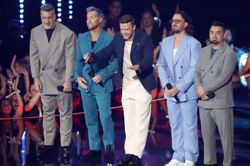 Left to right, Joey Fatone, Lance Bass, Justin Timberlake, J.C. Chasez and Chris Kirkpatrick of *NSYNC help present Taylor Swift the Best Pop award during the MTV Video Music Awards in Newark, N.J., in 2023. File Photo by John Angelillo/UPI