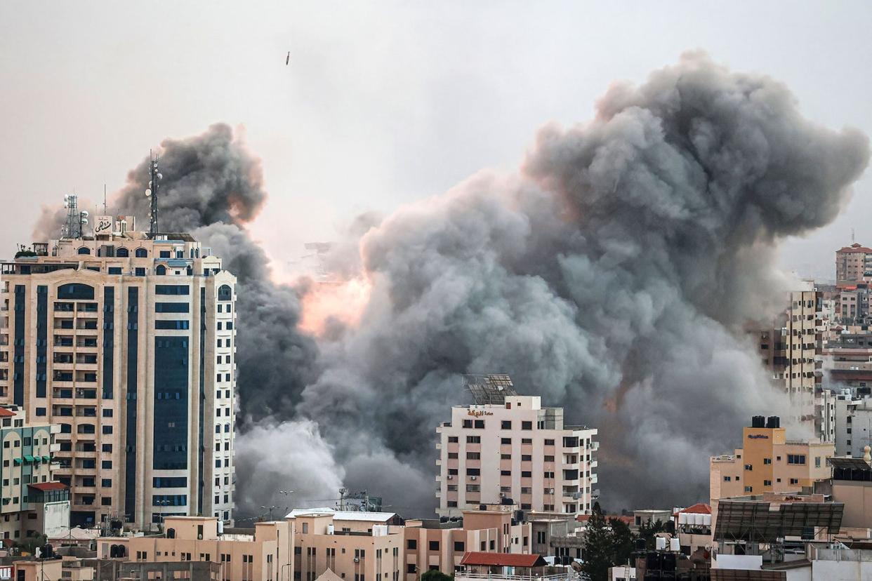 Flames and smoke billow from buildings in Gaza.