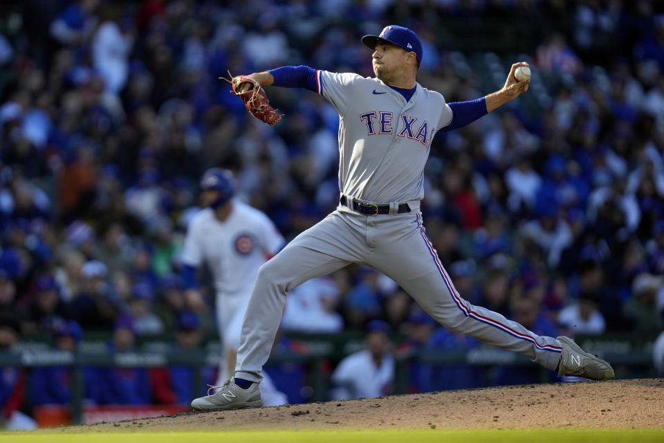 Texas Rangers relief pitcher Brock Burke throws during the sixth inning of a baseball game against the Chicago Cubs Saturday, April 8, 2023, in Chicago. (AP Photo/Erin Hooley)