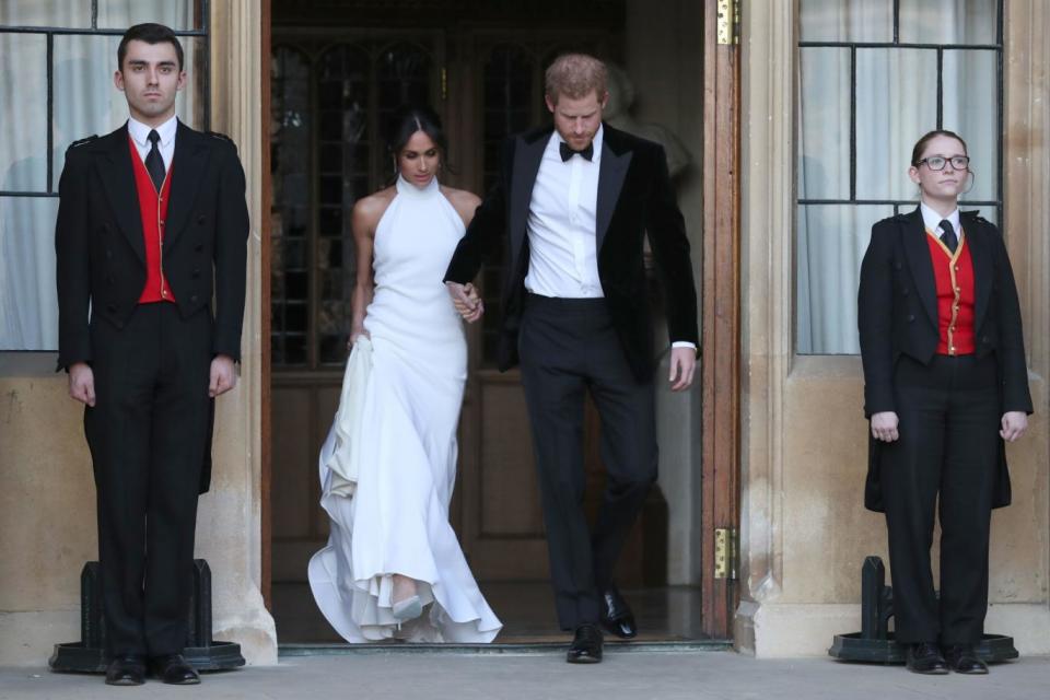 Harry and Meghan leaving Windsor Castle for the glamorous evening reception (PA)