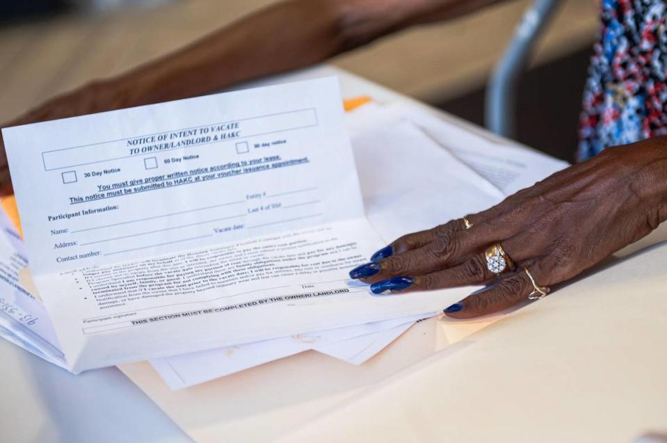 Vivian Jackson holds out a notice to vacate form at her home in Kansas City. Jackson is being forced to leave her home at the Emanuel Cleaver Senior Living Community by July 31. Zachary Linhares/zlinhares@kcstar.com