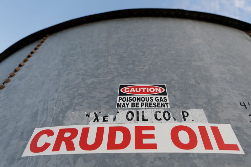 FILE PHOTO: A sticker reads crude oil on the side of a storage tank in the Permian Basin