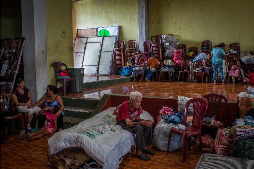 Residents of San Miguel Los Lotes rest in a shelter in Escuintla, a nearby city, on June 4.