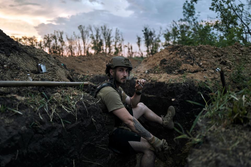 A Ukrainian soldier sits in a trench at the frontline near Bakhmut in the Donetsk region, Ukraine, Friday, 26 May 2023 (AP)