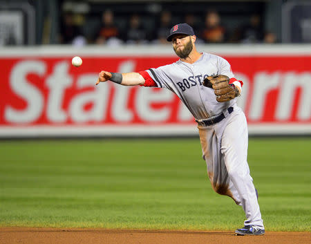 FILE PHOTO: Boston Red Sox second baseman Dustin Pedroia makes the throw to first, getting Baltimore Orioles baserunner Jonathan Schoop to end the fourth inning during their MLB American League baseball game in Baltimore, Maryland September 27, 2013. REUTERS/Doug Kapustin