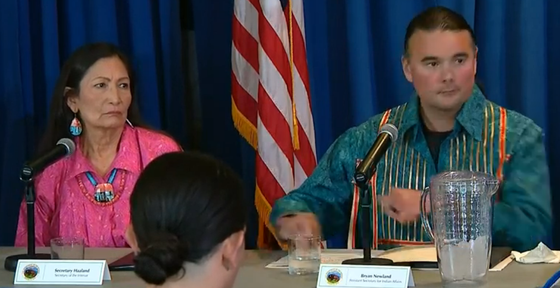 Interior Secretary Deb Haaland (Laguna Pueblo) and Indian Affairs Secretary Bryan Newland (Bay Mills Indian Community) at a press conference at the release of the Indian boarding school report on May 11, 2022. (Photo/C-Span)