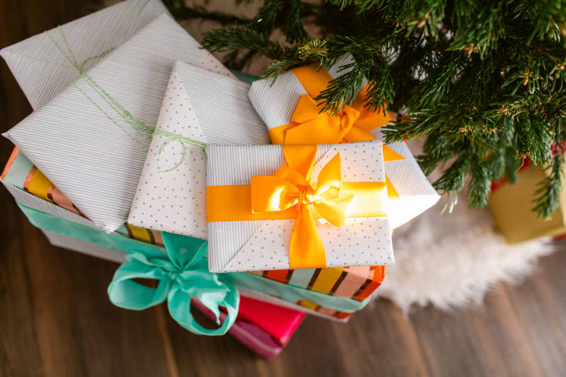 pile of presents under a christmas tree