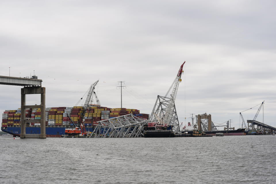 A bulk carrier moves through a newly opened deep-water channel in Baltimore after being stuck in the harbor since the Francis Scott Key Bridge collapsed four weeks ago, Thursday, April 25, 2024. (AP Photo/Matt Rourke)