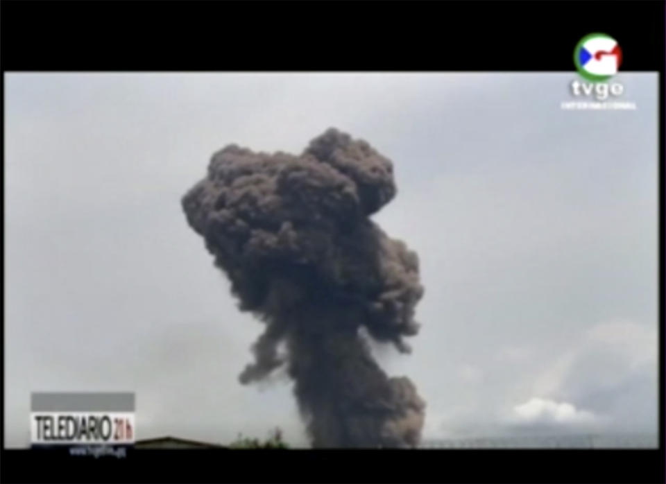 This TVGE image made from video shows smoke rising over the blast site at a military barracks in Bata, Equatorial Guinea, Sunday, March 7, 2021. A series of explosions killed at least 20 people and wounded more than 600 others on Sunday, authorities said. (TVGE via AP)