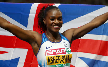 FILE PHOTO: 2018 European Championships - Women's 200 Meters, Final - Olympic Stadium, Berlin, Germany - August 11, 2018 - Dina Asher-Smith of Britain celebrates after winning a gold medal. REUTERS/Michael Dalder/File Photo