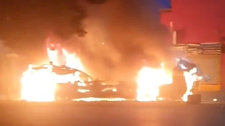 Flames engulf double-decker bus after riot breaks out in Leeds with hundreds on streets. (Damien Robinson)