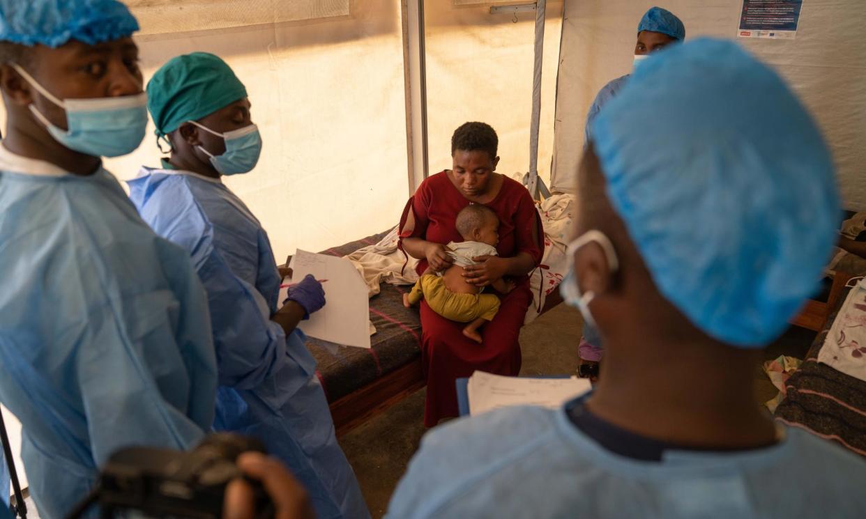 <span>Medical staff treat a woman and her baby for mpox at a health centre in Munigi, the Democratic Republic of the Congo.</span><span>Photograph: Moise Kasereka/EPA</span>