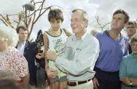 <p>President George H. W. Bush, First Lady Barbara Bush and son Jeb visit victims of Hurrcane Andrew in Florida on September 1, 1992. (AP) </p>