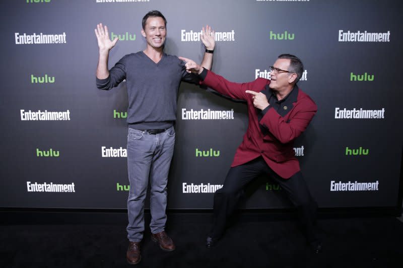 Bruce Campbell (R) and "Burn Notice" costar Jeffrey Donovan, pose at New York Comic-Con. File Photo by John Angelillo/UPI