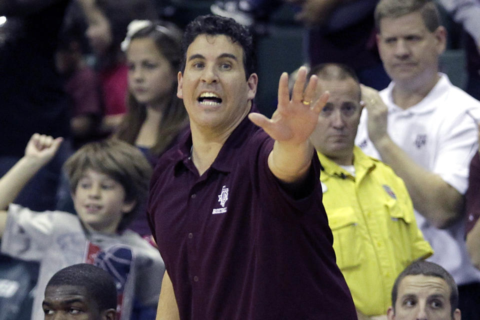 FILE - In this Nov. 28, 2010, file photo, then Texas A&M assistant coach Scott Spinelli calls to players during an NCAA college basketball game against Temple in Lake Buena Vista, Fla. Spinelli will take over as Boston College's interim men's basketball head coach against Notre Dame on Saturday Feb. 27, 2021. (AP Photo/John Raoux)