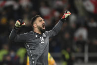 Georgia's goalkeeper Giorgi Mamardashvili reacts after his save during a penalty shootout at the end of the Euro 2024 qualifying play-off soccer match between Georgia and Greece at the Boris Paichadze National Stadium in Tbilisi, Georgia, Tuesday, March 26, 2024. (AP Photo/Tamuna Kulumbegashvili)