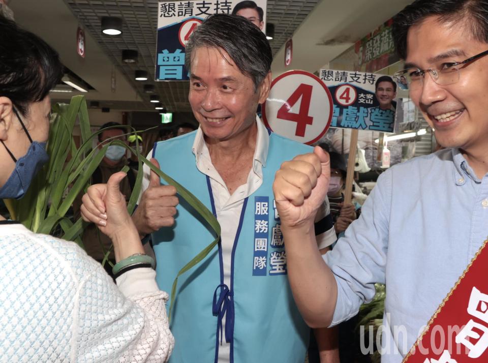 Former National Security Council Secretary General Jin Pucong went to Xinglong Market in Taipei City's Wenshan District in the morning to accompany non-partisan city council candidate Zeng Xianying to the market to sweep the streets and ask for votes , avoiding talking about the Taipei mayoral election.Reporter Huang Yishu/Photo