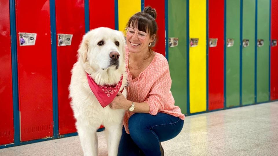 Stéphanie Lavallée pictured with Benjamin. She completed 560 hours of training as part of a zootherapy program. (Josée Ducharme/Radio-Canada - image credit)