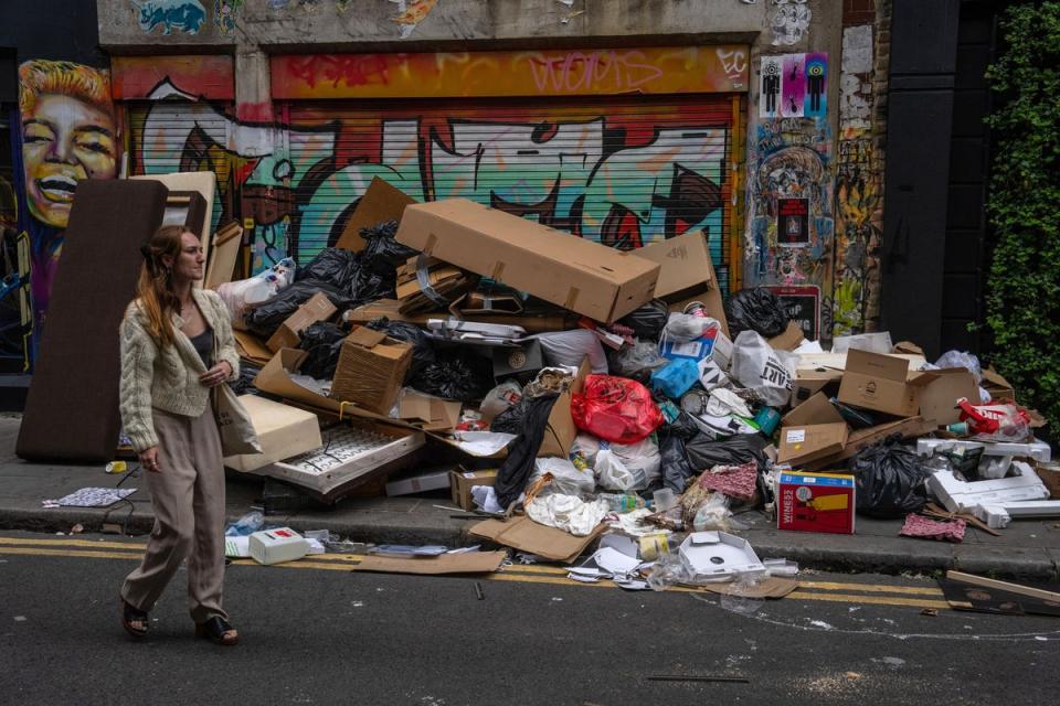 Rubbish piled in a street off Brick Lane during an ongoing strike by Tower Hamlets refuse collectors, 2023 (Getty Images)