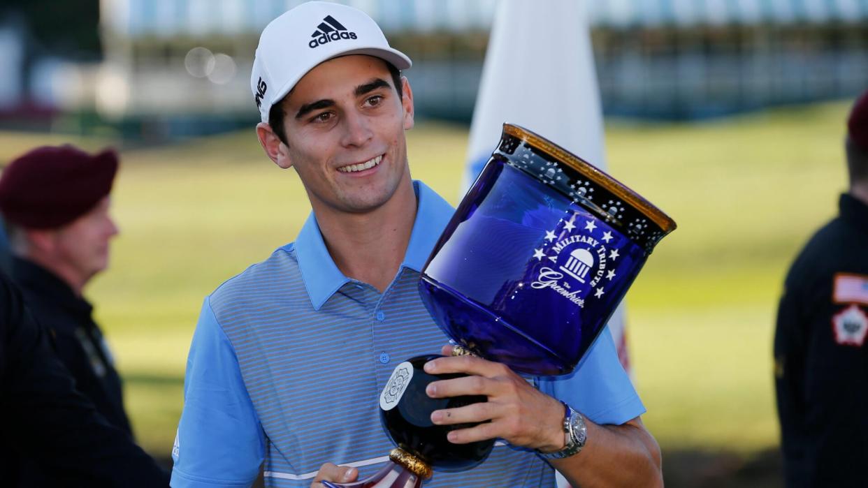 Mandatory Credit: Photo by Steve Helber/AP/Shutterstock (10414557y)Joaquin Niemann, of Chile, holds the winners trophy as he celebrates winning the A Military Tribute at The Greenbrier golf tournament in White Sulphur Springs, W.