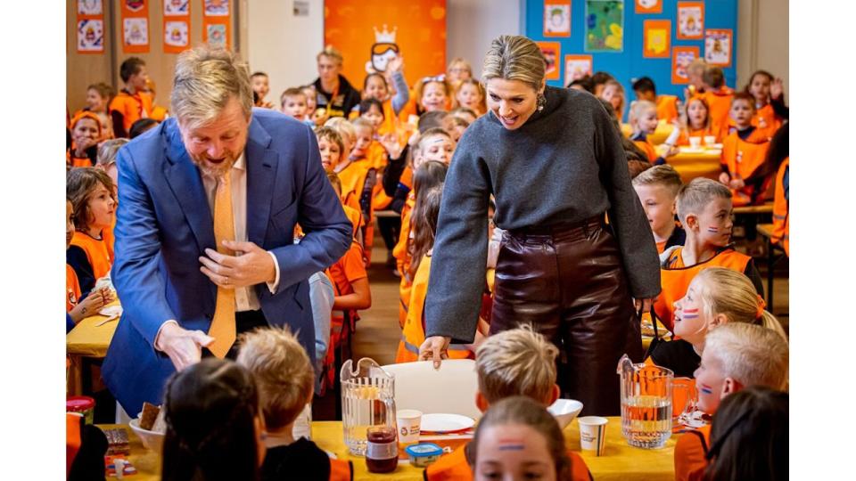 King Willem-Alexander and Queen Maxima at a school with children