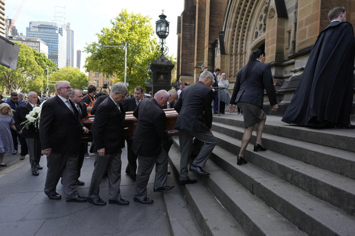 The coffin of Cardinal George Pell is carried into St. Mary's Cathedral in Sydney, Wednesday, Feb. 1, 2023. Pell, who was once considered the third-highest ranking cleric in the Vatican and spent more than a year in prison before his child abuse convictions were squashed in 2020, died in Rome last month at age 81. (AP Photo/Rick Rycroft)