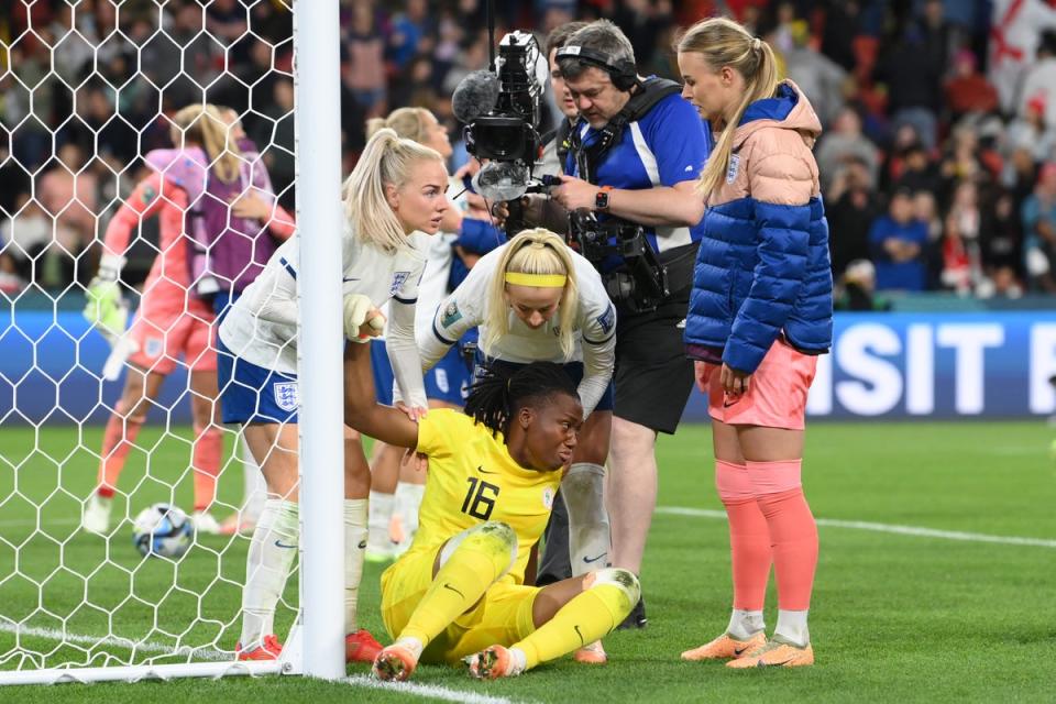 Chiamaka Nnadozie of Nigeria is consoled by England players (Getty Images)