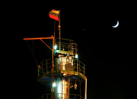 A Russian state flag flies on the top of a diesel plant in the Yarakta Oil Field, owned by Irkutsk Oil Company (INK), in Irkutsk Region, Russia March 10, 2019. REUTERS/Vasily Fedosenko