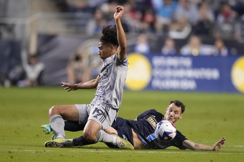 Philadelphia Union's Déniel Gazdag, right, collides with CF Montréal's Nathan-Dylan Saliba during the first half of an MLS soccer match, Saturday, June 3, 2023, in Chester, Pa. (AP Photo/Matt Slocum)