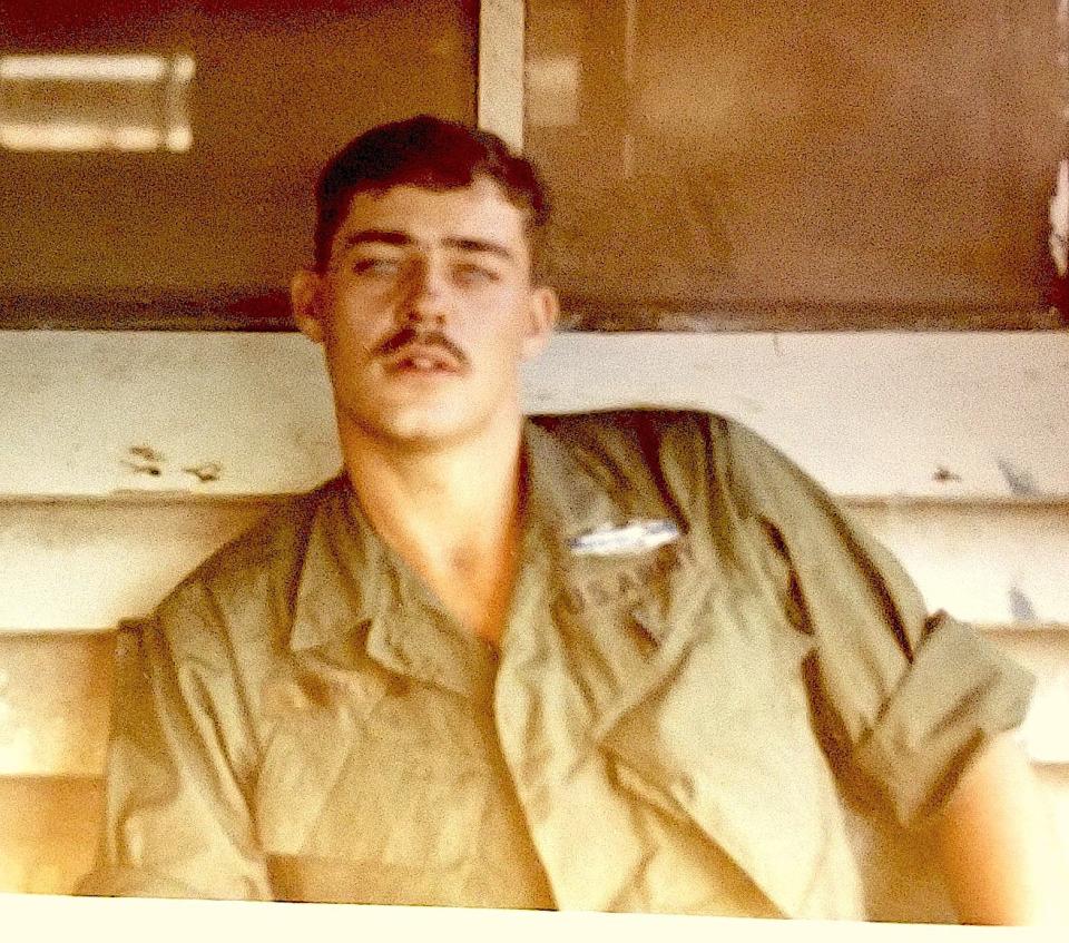 Ken Howe, wearing the Combat Infantryman Badge, at base camp in Vietnam, 1969.