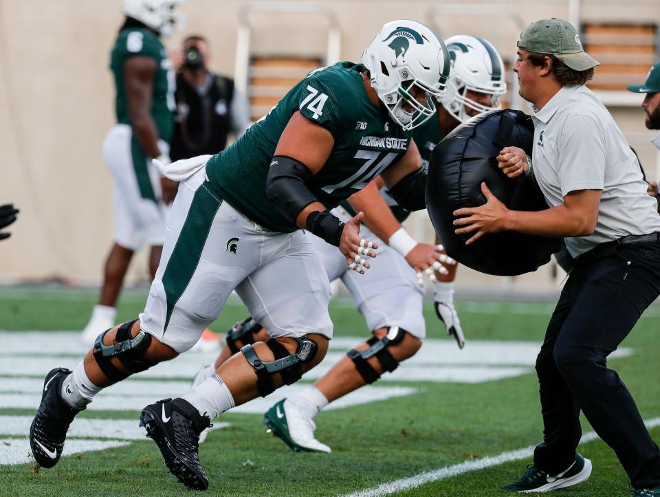 Michigan State offensive lineman Geno VanDeMark (74) warms up before the game against Western Michigan at Spartan Stadium in East Lansing on Friday, Sept. 2, 2022.