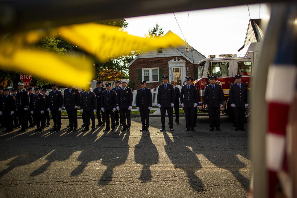 New York Fire Department members attend a second funeral service for FDNY firefighter Michael Haub in Franklin Square, N.Y., Tuesday, Sept. 10, 2019. The firefighter from Long Island who died in the World Trade Center attacks is being remembered for a second time on the eve of the 18th anniversary of 9/11. Friends and family gathered at the memorial service for Haub on Tuesday in Franklin Square. Last week, the New York City medical examiner identified more of his remains recovered at ground zero. (AP Photo/Eduardo Munoz Alvarez)