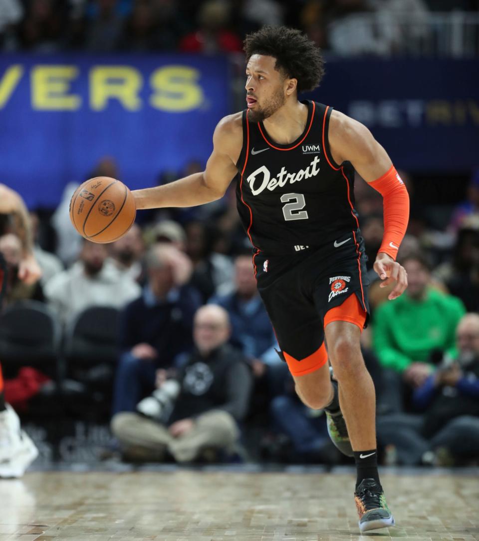 Detroit Pistons guard Cade Cunningham (2) brings the ball up court against the Phoenix during second-quarter action at Little Caesars Arena in Detroit on Sunday, Nov. 5, 2023.