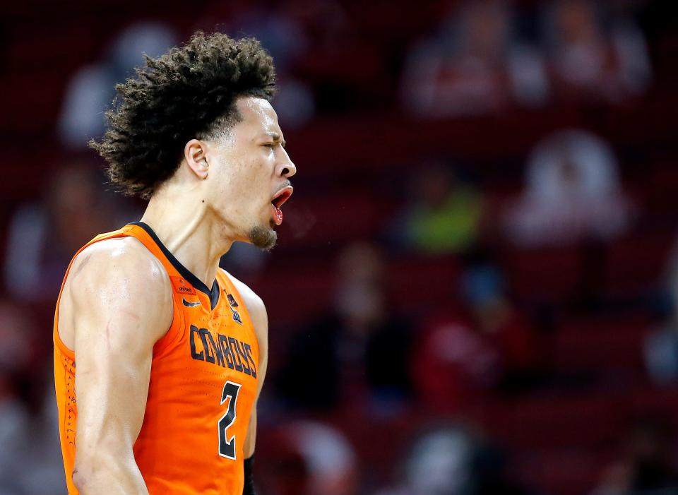 Oklahoma State's Cade Cunningham celebrates after a basket against Oklahoma during an overtime win Feb. 27, 2021 in Norman, Okla.