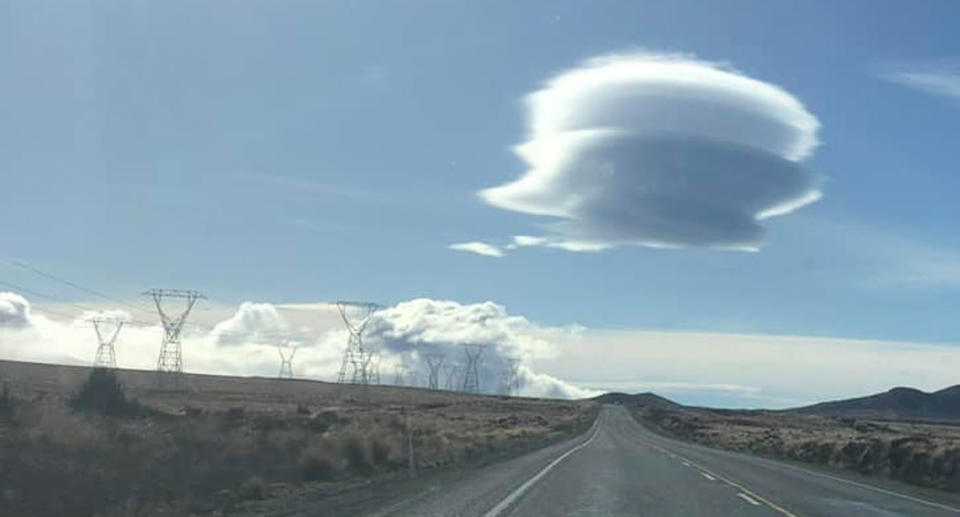 Lenticular cloud in sky over New Zealand along Desert Road. 