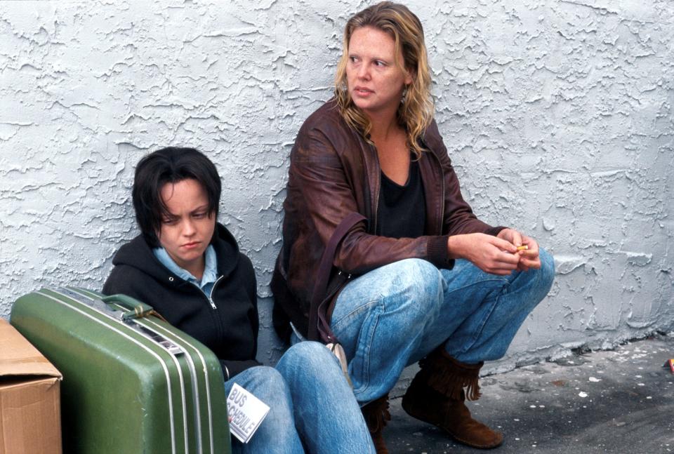 In "Monster," Charlize Theron, right, performs as Aileen Wournos, a serial killer of men who was executed in 2002. Christina Ricci, left, plays Wournos' girlfriend, Selby Wall.