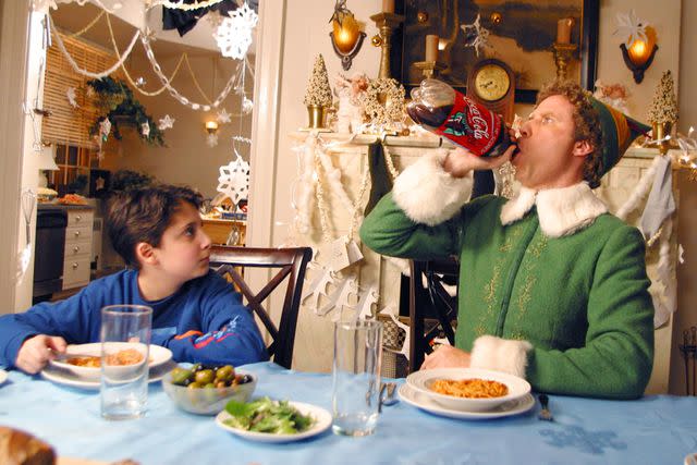 <p>New Line/ Everett</p> Daniel Tay and Will Ferrell in <em>Elf</em> (2003)