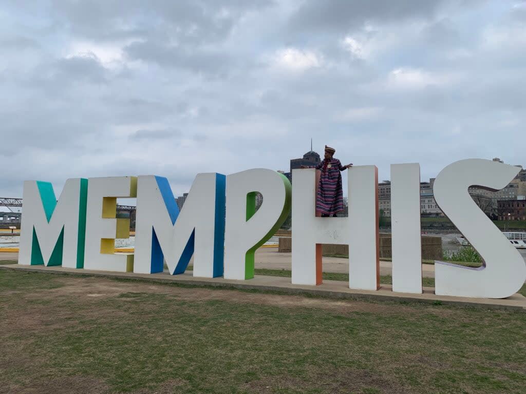 Eli Townsend climbing the iconic Memphis letters on Mud Island for a photoshoot with Friends of George’s to raise awareness for the drag queen ban (Photo: Daniel Scheffler)