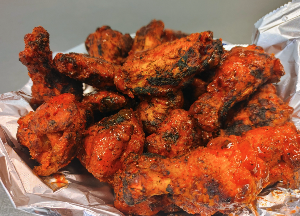 Taste of Buffalo Pizzeria chargrills its wings.