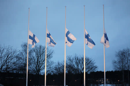 Finnish flags wave at half-mast in remembrance of the victims that were killed during a shooting incident that took place at a restaurant in Imatra, Finland December 5, 2016 Lehtikuva/Lauri Heino/via REUTERS ATTENTION EDITORS - THIS IMAGE WAS PROVIDED BY A THIRD PARTY. FOR EDITORIAL USE ONLY. NO THIRD PARTY SALES. NOT FOR USE BY REUTERS THIRD PARTY DISTRIBUTORS. FINLAND OUT. NO COMMERCIAL OR EDITORIAL SALES IN FINLAND.