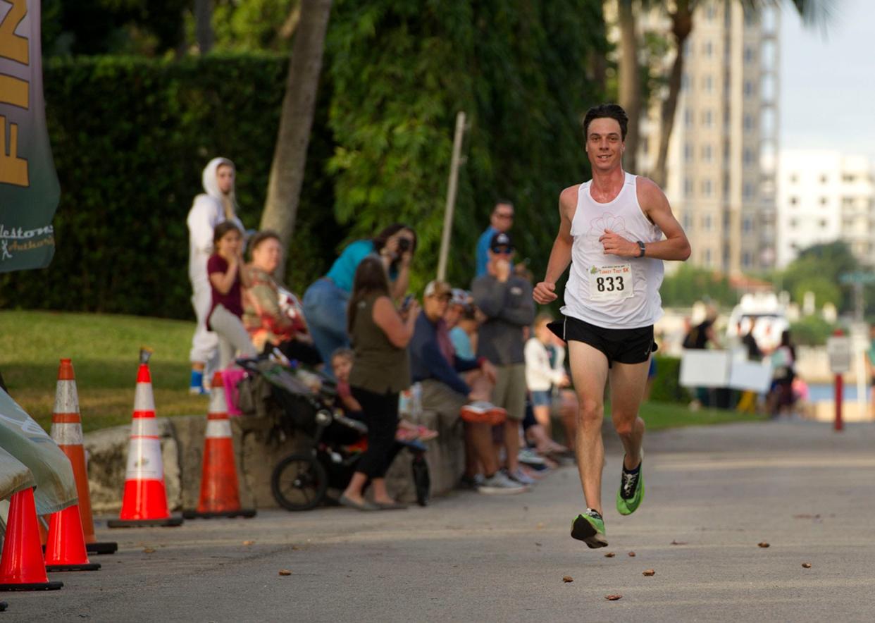 Mackenzie Mettille of Gypsum, Colo., approaches the end of his first-place finish in November 2021 at the Thanksgiving Day Turkey Trot 5K. Mettille also won the race in 2019.