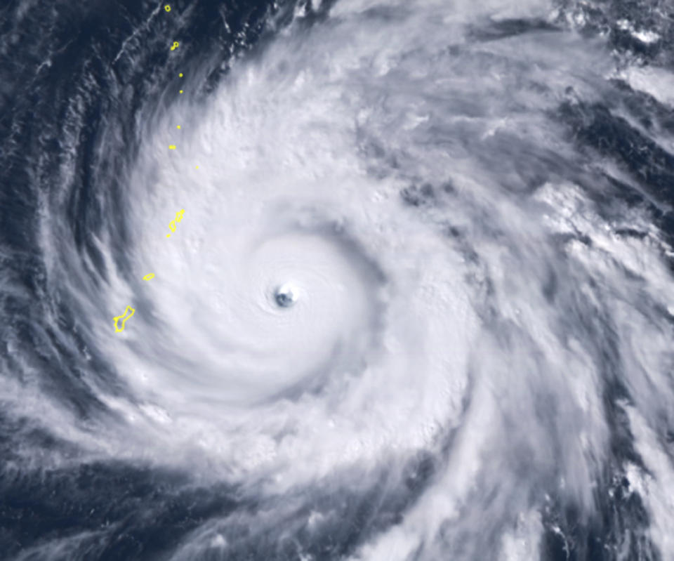 A satellite image shows Typhoon Yutu east of Guam, set to cross over the U.S. commonwealth of the Northern Mariana Islands with damaging winds. (Photo: ASSOCIATED PRESS)