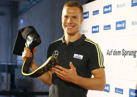 German paraolympic long jumper Markus Rehm aka "Blade Jumper" poses after a news conference in Cologne, Germany, May 30, 2016. REUTERS/Wolfgang Rattay